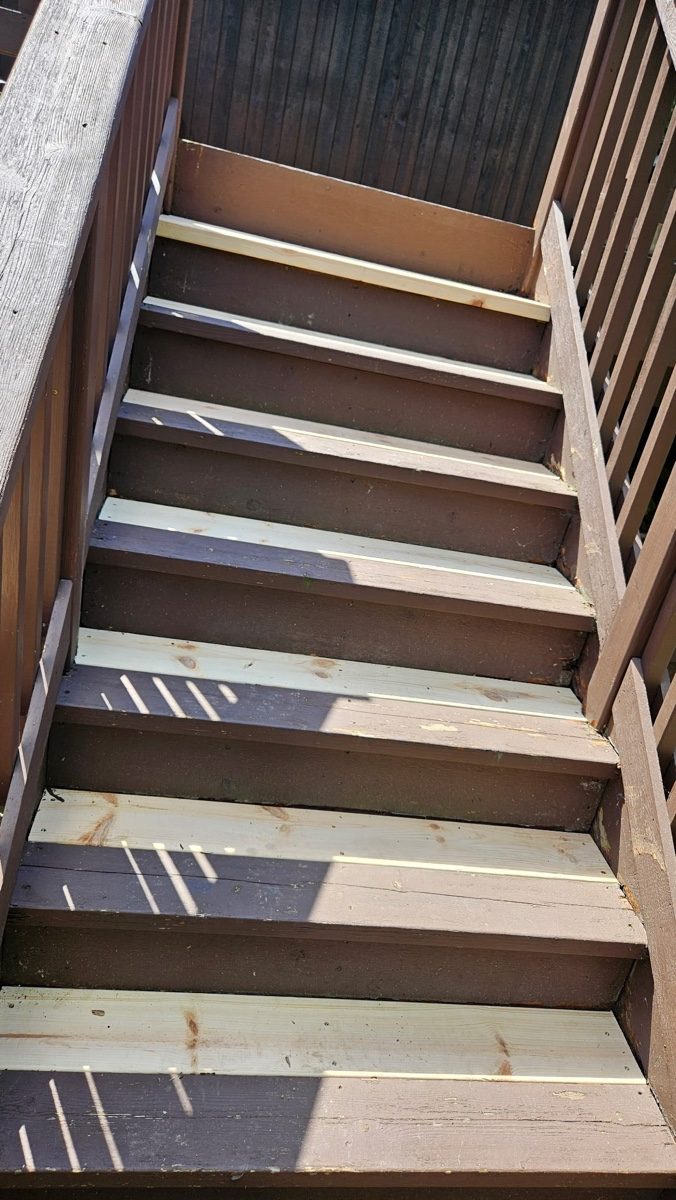 Deck stairs restored with new code-compliant boards by XXX Landscape