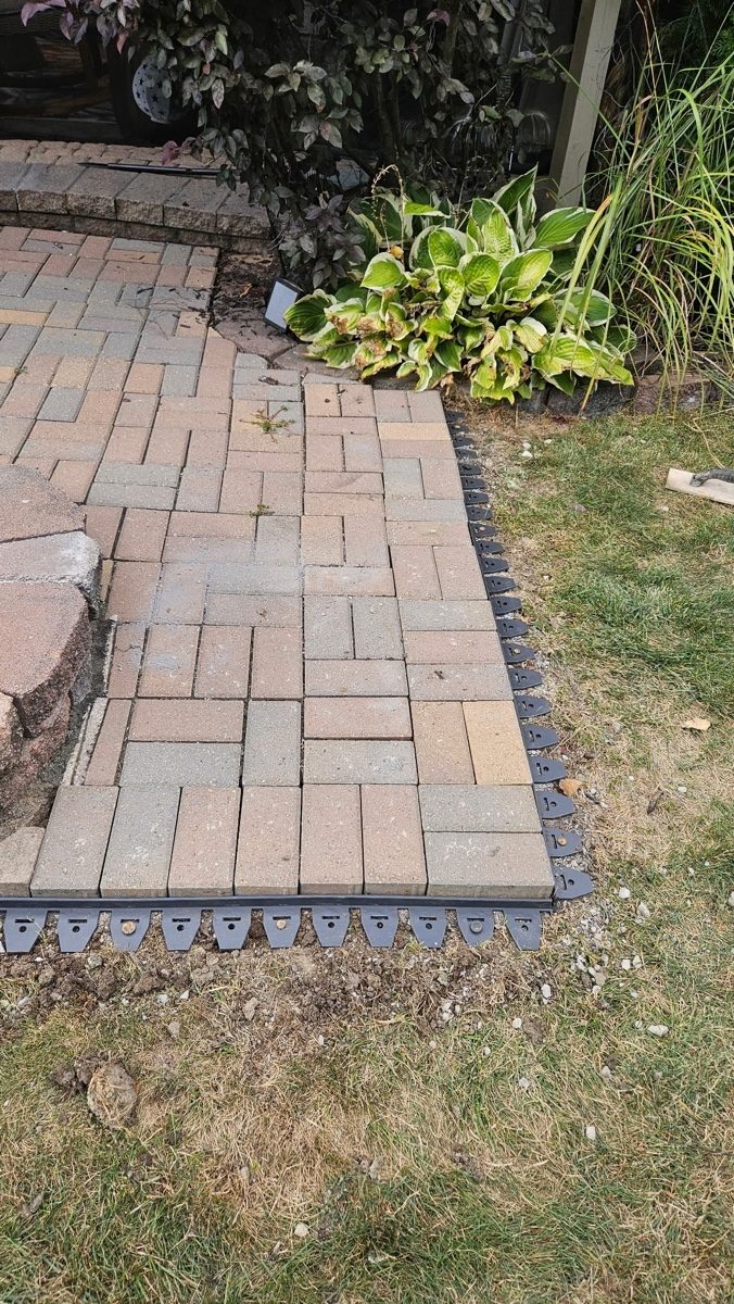 Brick paver surface installed by XXX Landscape