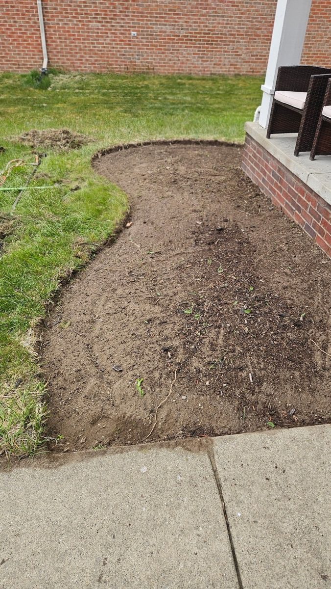 New planting bed excavated and graded prior to installation